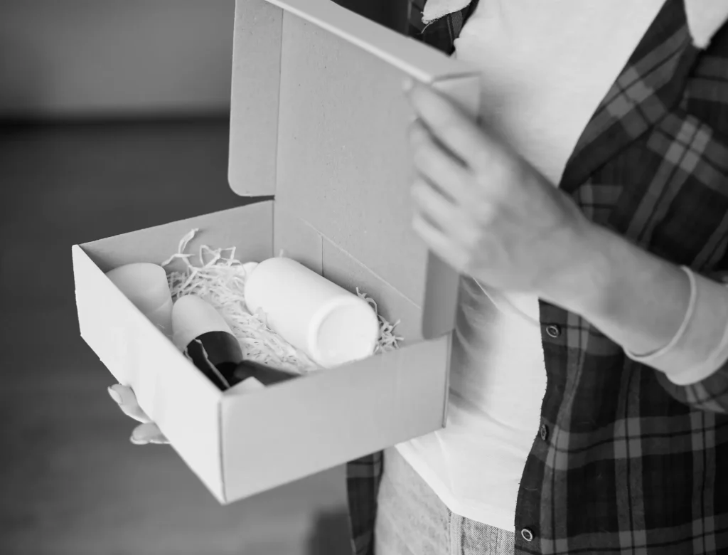 Female logistics worker carefully inspecting a bespoke luxury gift box