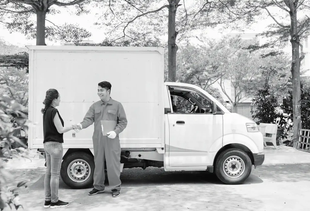 Delivery courier shaking hands with customer