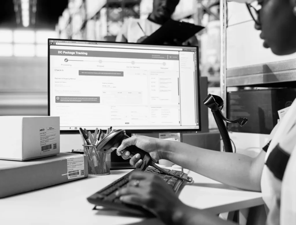 A woman analysing reports and supply chain analytics